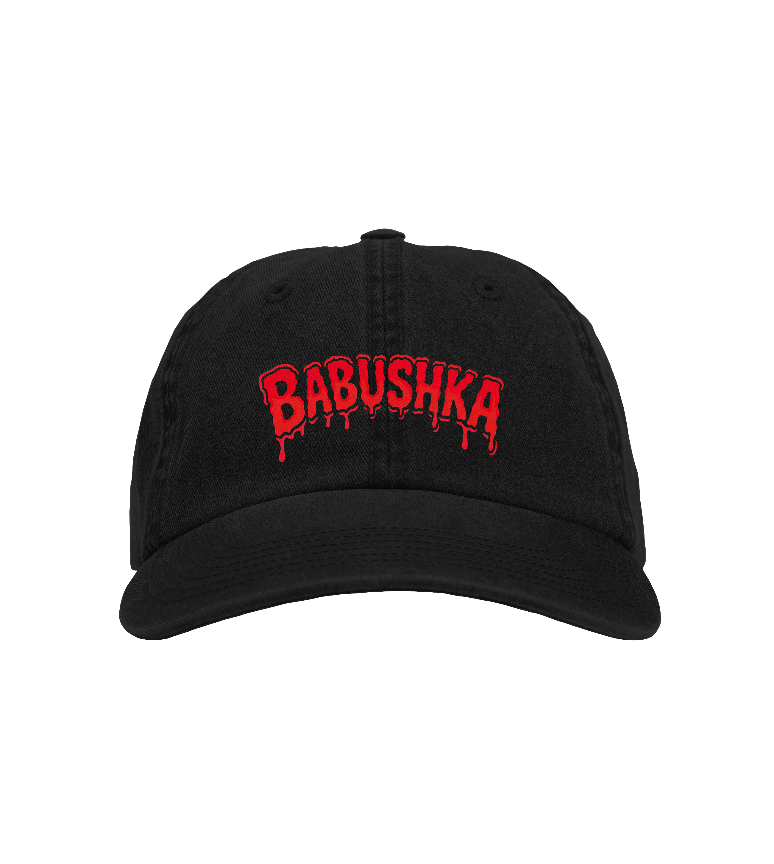 Black six-panel organic cotton baseball cap with red embroidered “BABUSHKA” logo, hard brim, velcro strap, and ridged texture.